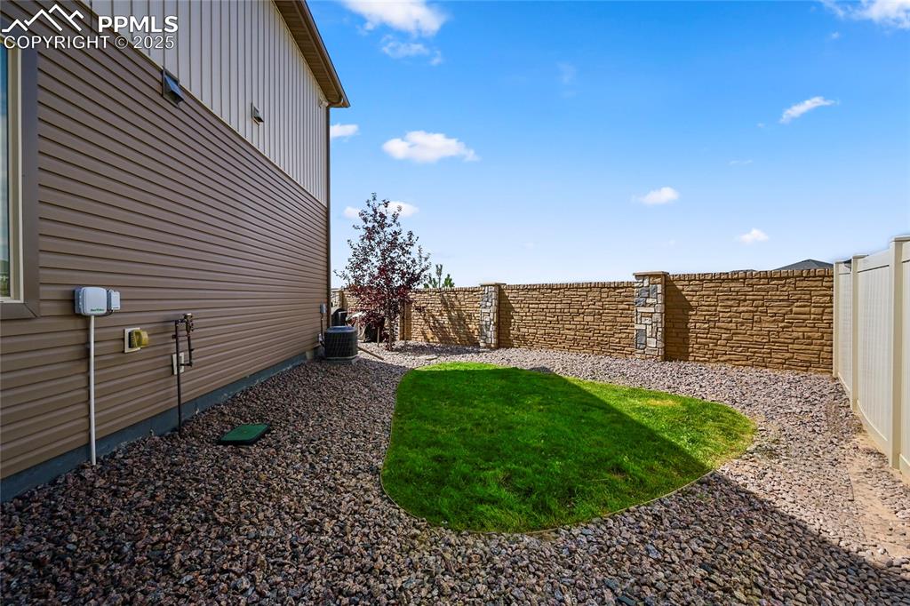 View of fenced backyard