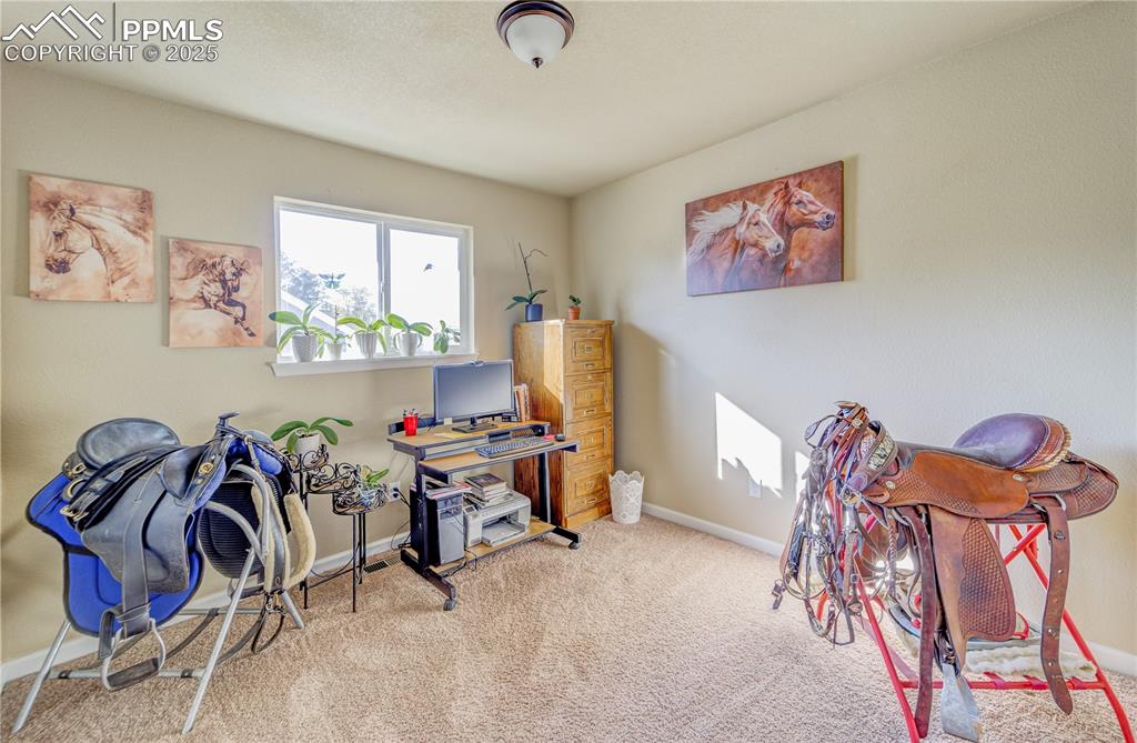 1st Bedroom upper floor, featuring light colored carpet