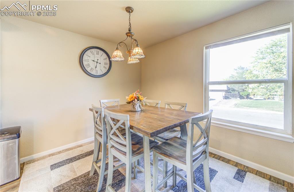 Dining space featuring an inviting natural light and light hardwood / wood-style floors