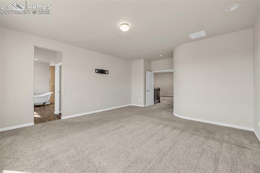 Empty room featuring carpet