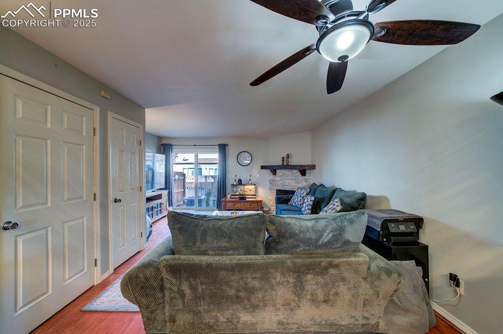 The spacious Living Room has wood laminate floors and walks out to a concrete patio for outdoor relaxation.