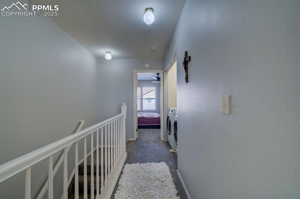 Upepr level hallway with laundry closet.