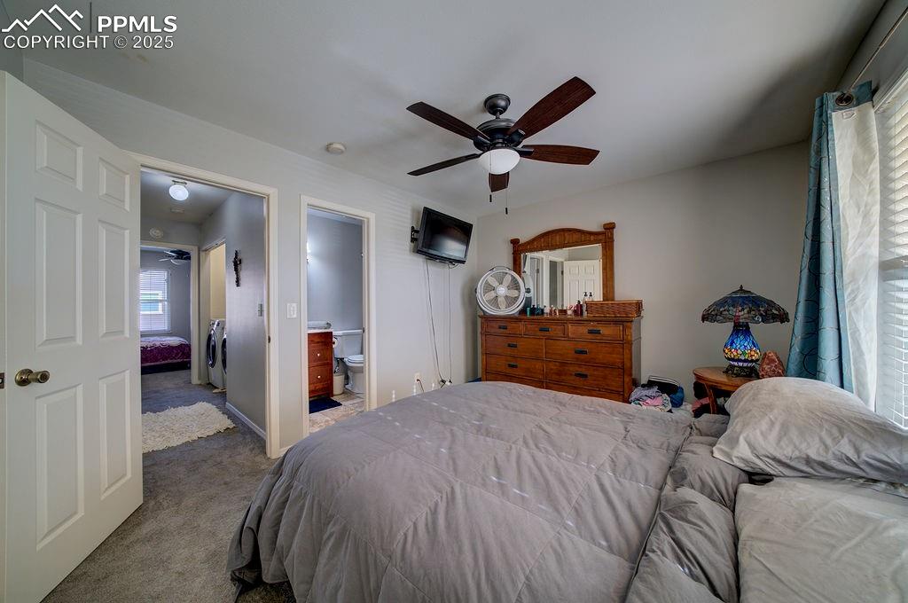 Primary Bedroom with view into the Primary Bathroom.