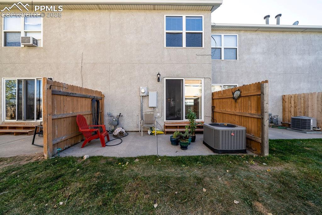 Backyard patio, great for outdoor BBQs and relaxation.