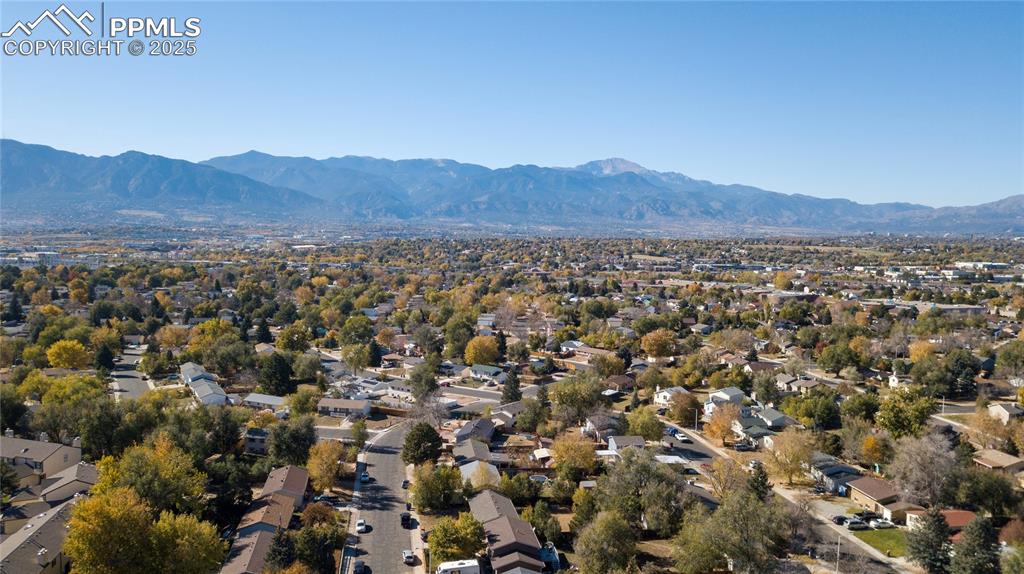 Aerial perspective of suburban area with a mountain backdrop