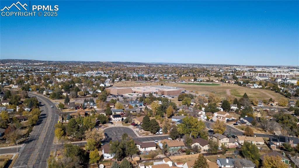 View of property location with nearby suburban area