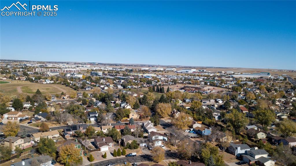 Aerial overview of property's location featuring nearby suburban area