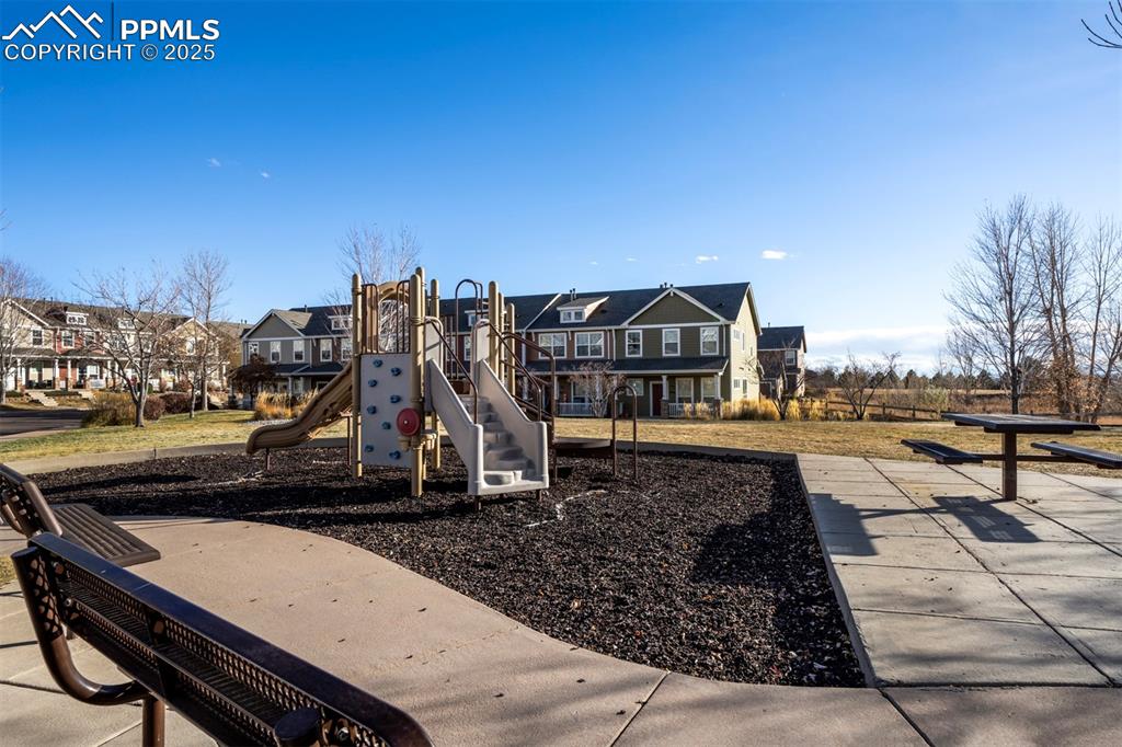 Community jungle gym featuring a residential view