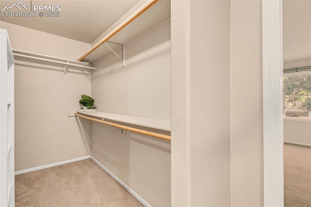 Master bedroom closet offering ample storage space. 
