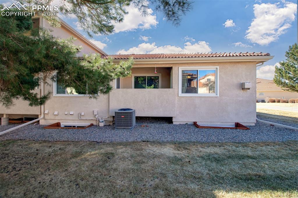 Covered patio at the rear of the home, ideal for morning coffee. 