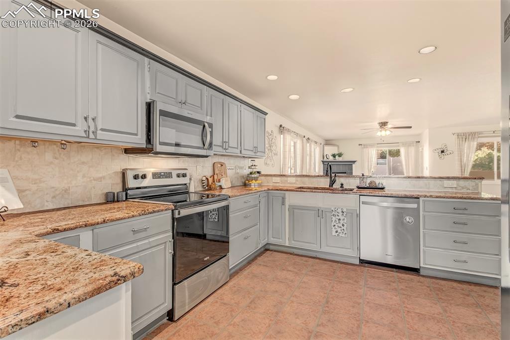 Thoughtfully designed kitchen offering granite countertops, abundant cabinets, stainless steel appliances and two lazy susans for easy organization. 