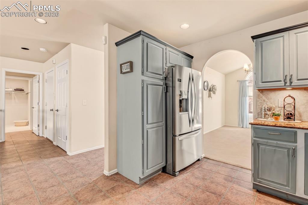 Kitchen with clear view of the formal dining room plus easy access to the nearby 1/2 bath and laundry room.  