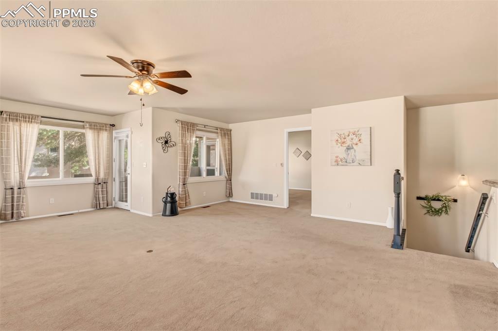 From the living room, enjoy easy access to the covered patio, master bedroom and basement creating a seamless flow throughout the home. 