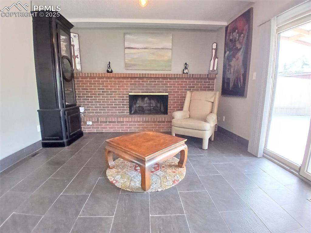 Main level family room featuring a full wall brick fireplace!!
