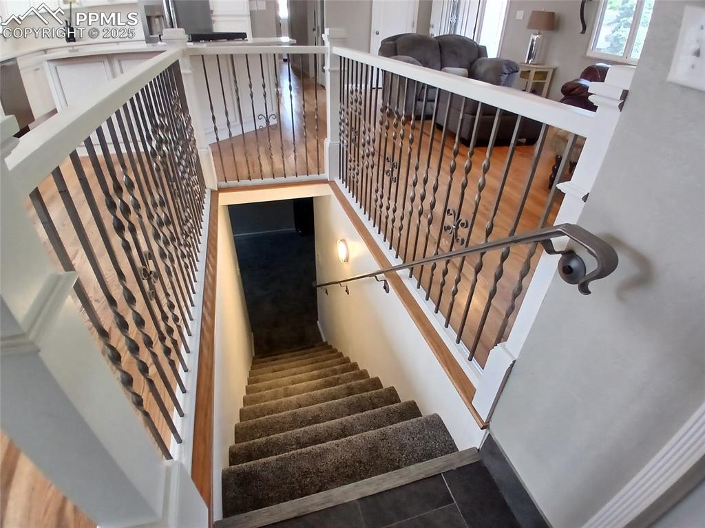 Staircase featuring tile floors