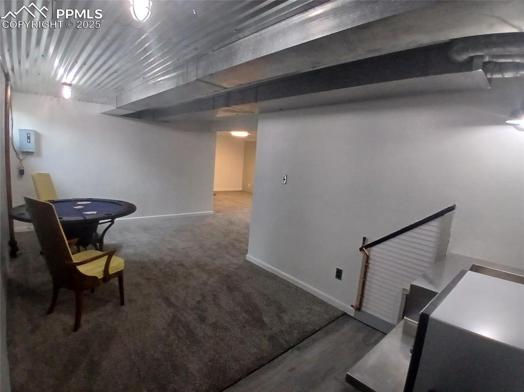 Basement with carpet flooring