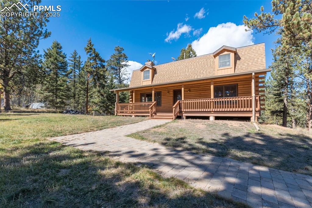 Welcoming covered deck overlooking front yard
