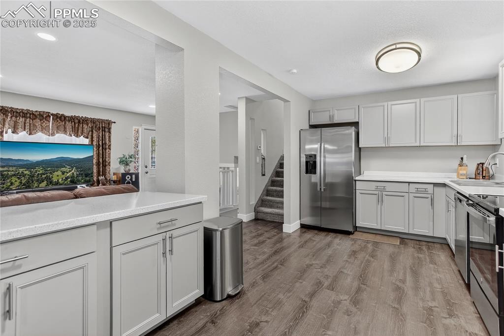 Hand-through window from living room to kitchen
