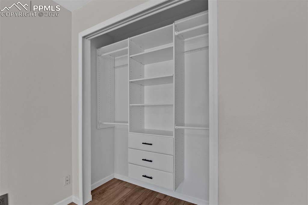 Built-ins in Primary Closet. Doors are available and will be left with the home.