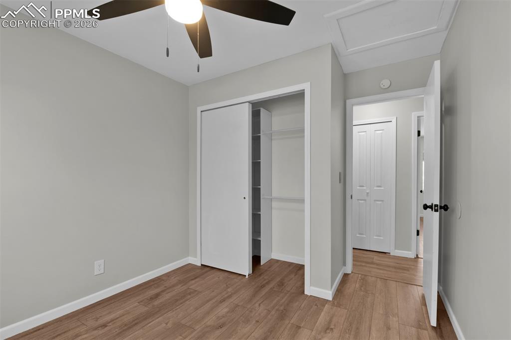 Secondary Bedroom #2 with fresh paint and updated LVP flooring. 