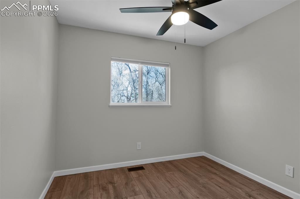 Secondary Bedroom #2 with fresh paint and updated LVP Flooring. 