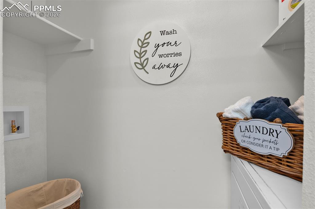Laundry Area conveniently located on the same level as the bedrooms and built in shelving and storage. 