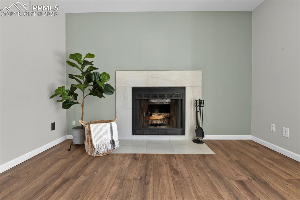 Family room has a wood burning fireplace for cozy winters. 
