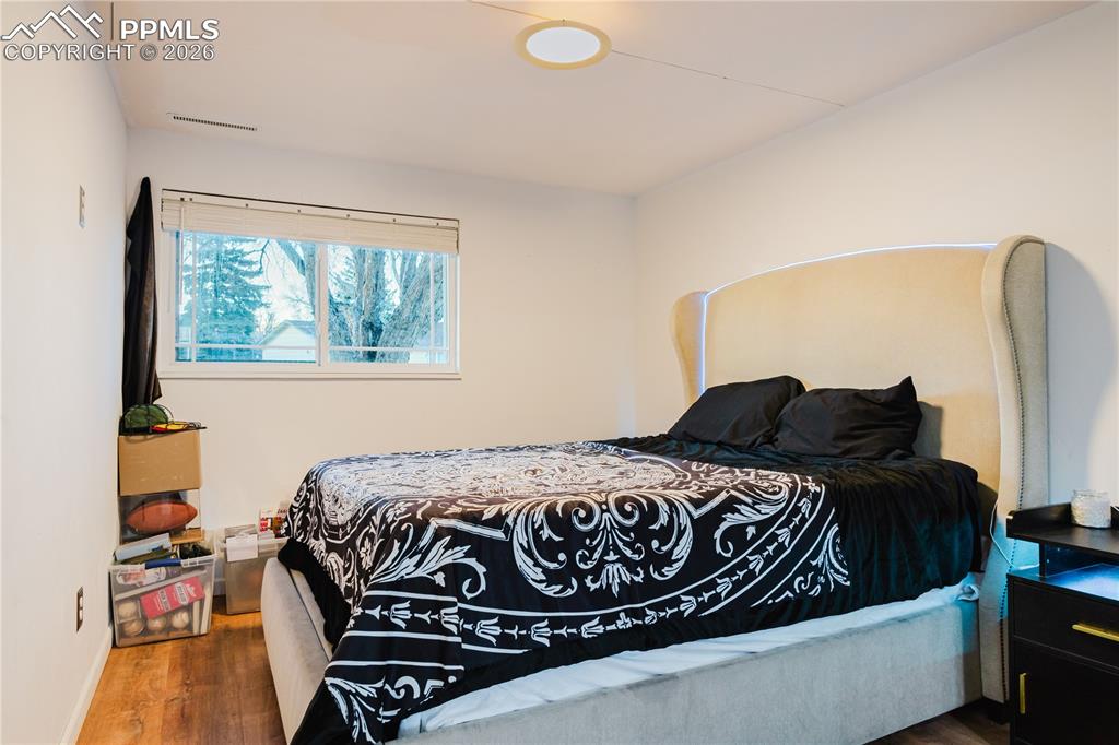Bedroom with wood finished floors