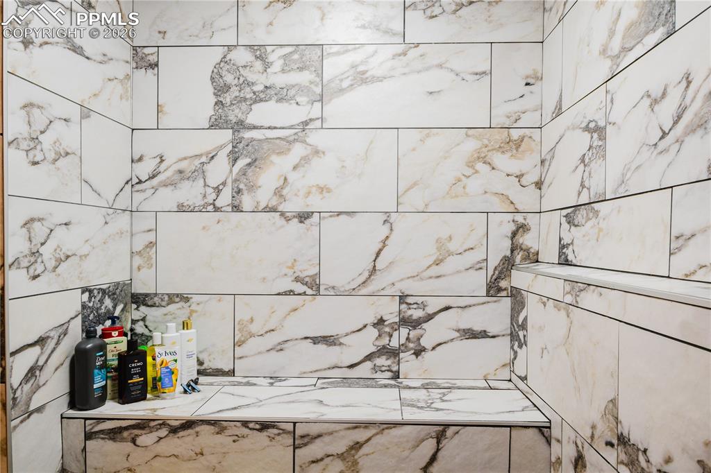 Bathroom view of a tile shower