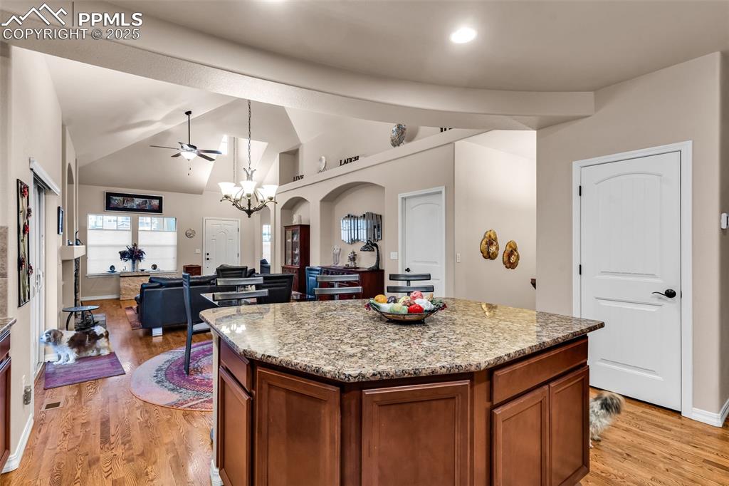 The kitchen is wonderful for entertaining, with a large center island providing counter seating on two sides, with abundant storage for large appliances.
