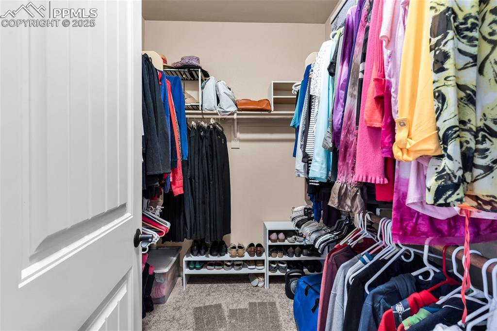A spacious walk in closet completes the bedroom suite, offering plenty of space for organizing your wardrobe.