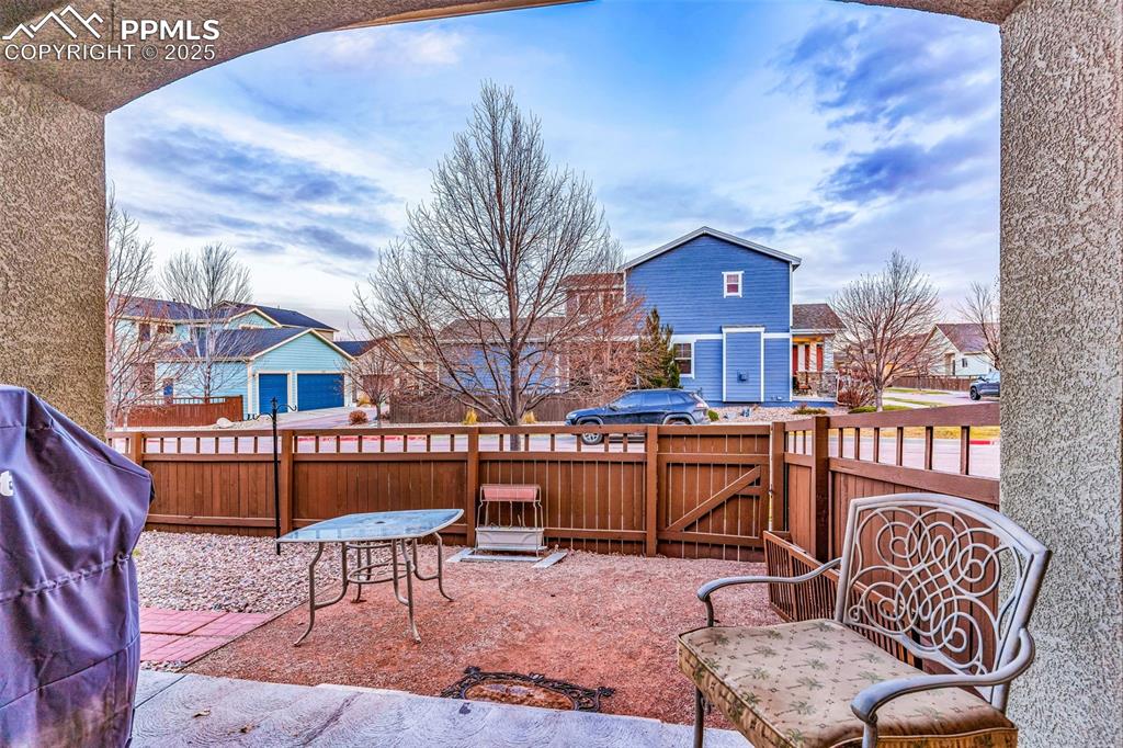 There is just one step from the main level to the covered patio and yard.