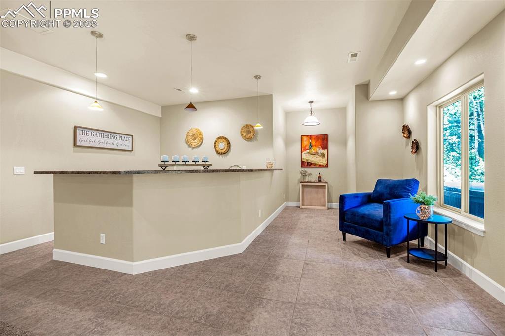 Living area featuring recessed lighting and baseboards