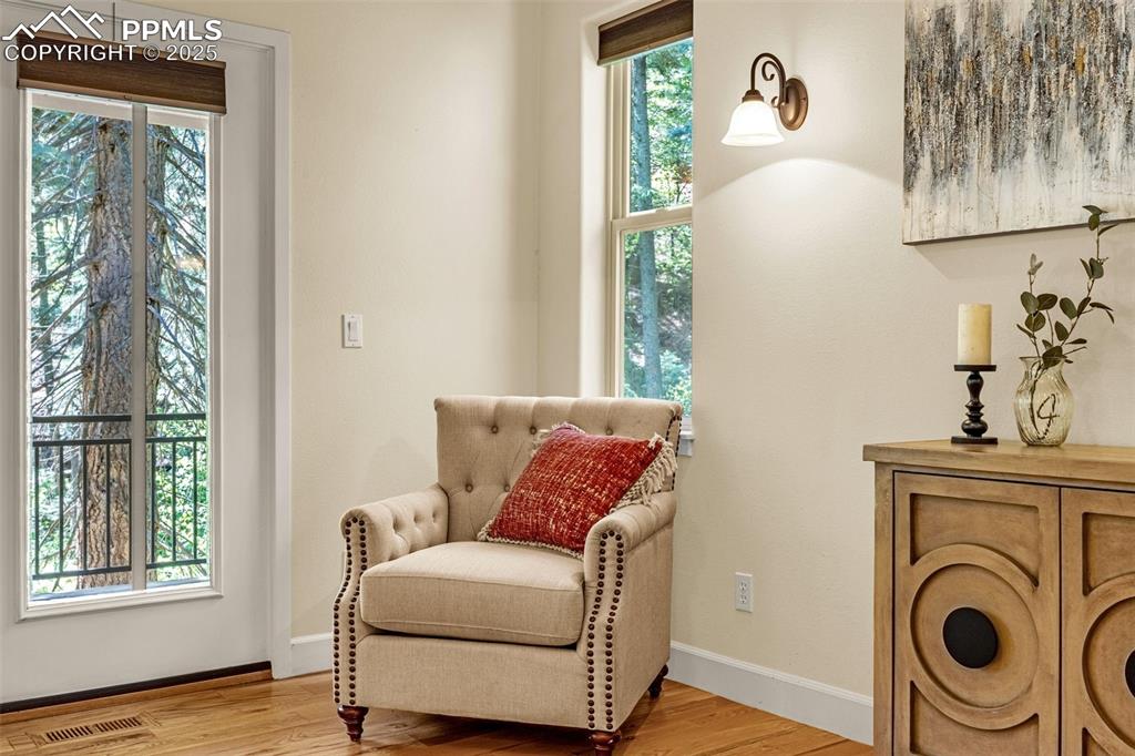 Sitting room with light wood-style flooring and baseboards