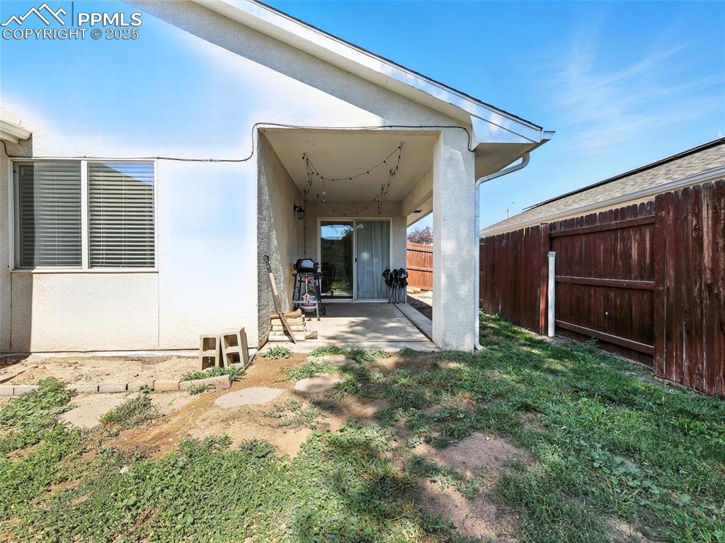 rear of house, view of covered patio