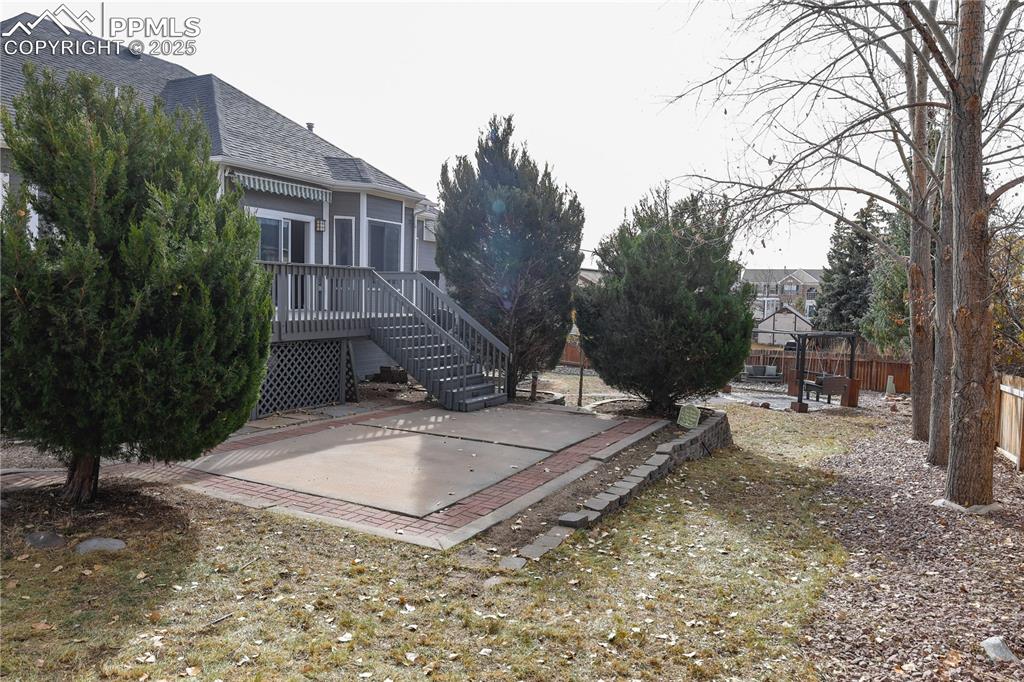 Spacious backyard with beautiful mature trees.