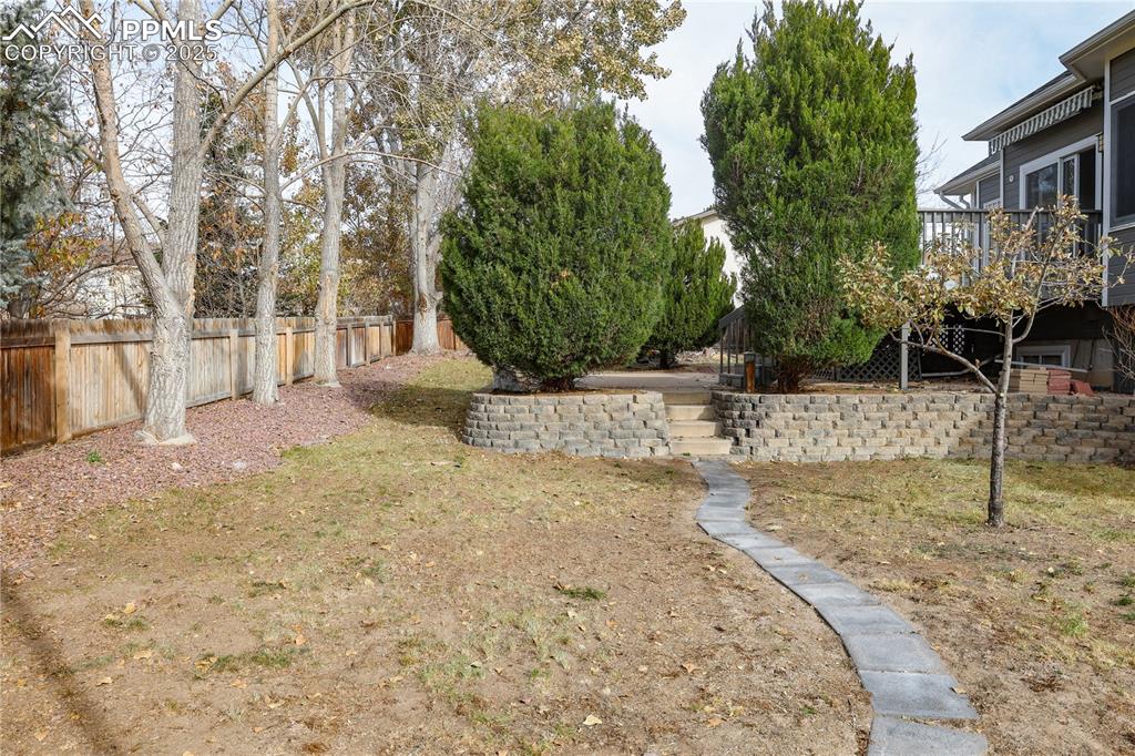 View of yard featuring a wooden deck