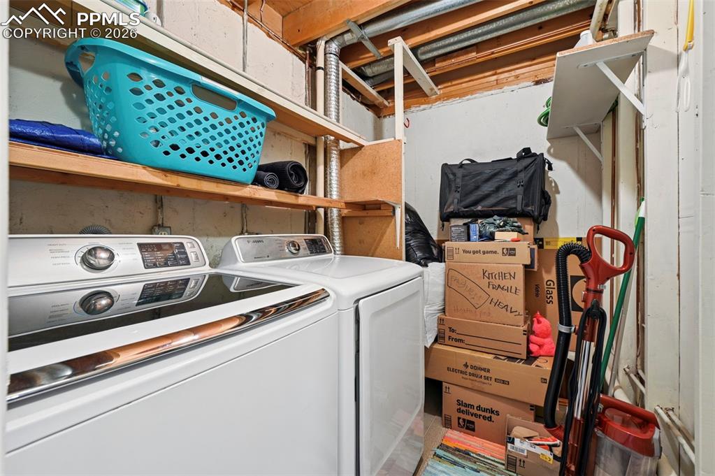 Laundry room in basement. Washer and Dryer stay