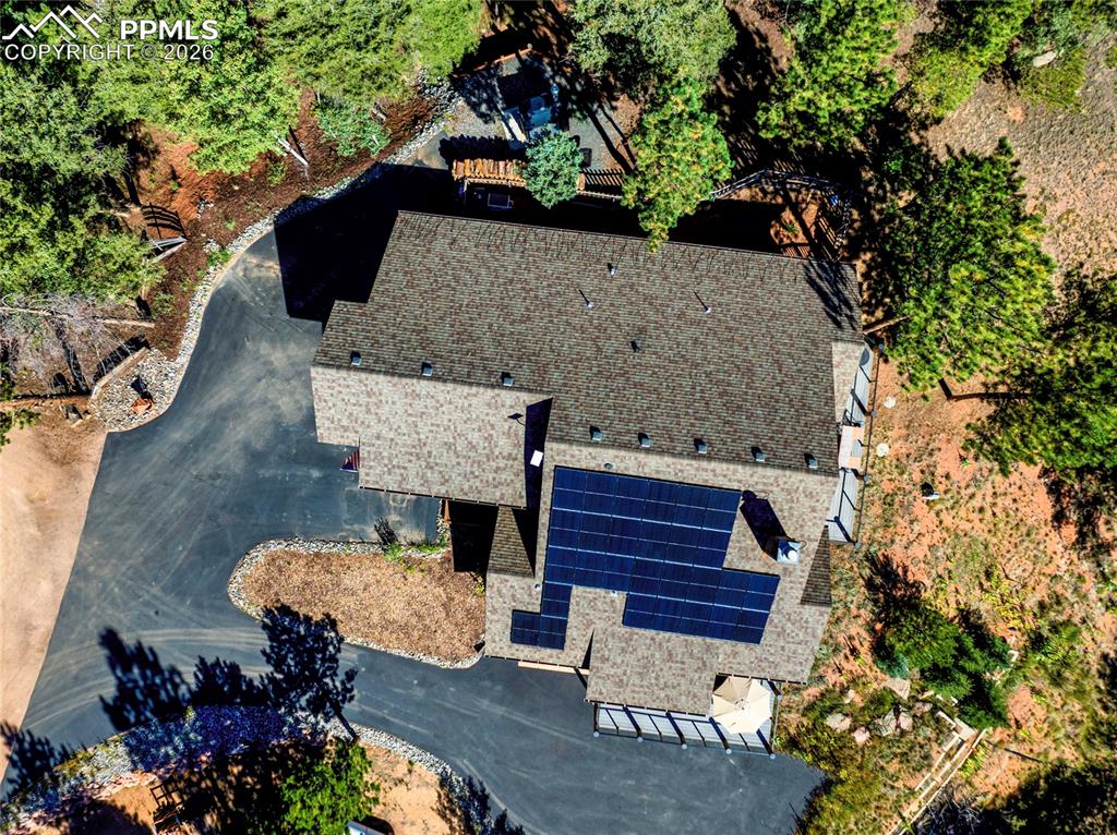 Outside you can see the fully paved driveway, and those coveted solar panels!