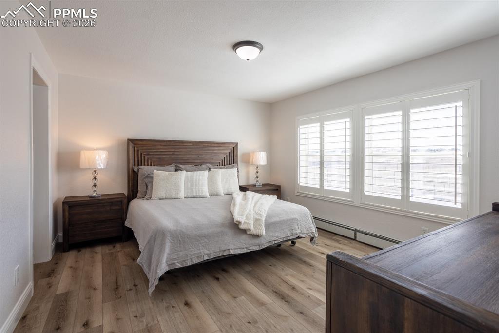 Bedroom featuring vinyl plank flooring