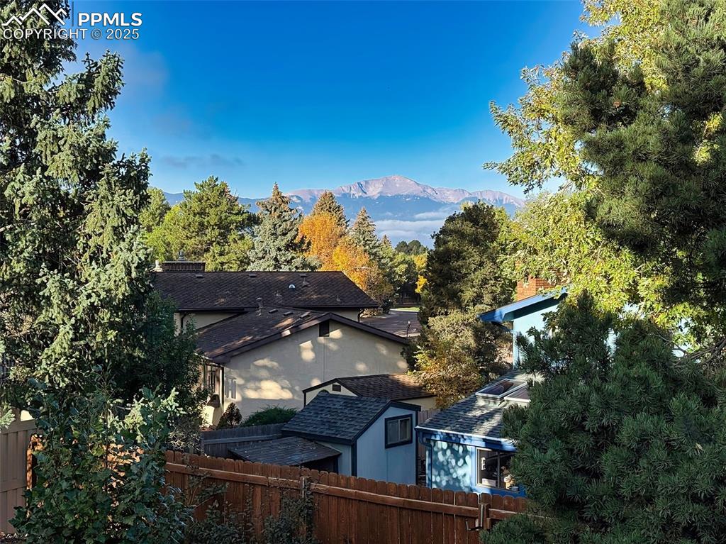 Beautiful mountain views peek through the treetops, offering a scenic and serene backdrop from the upper level or backyard.