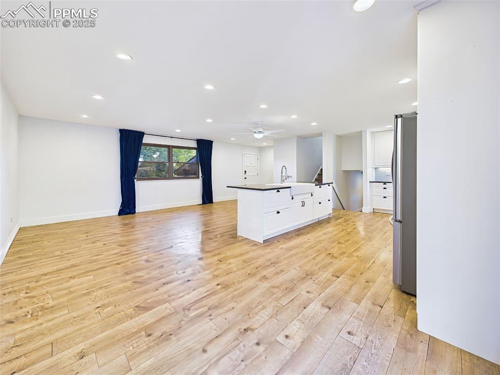 Open main level offers abundant space and flexibility, with expansive windows and stylish finishes throughout.