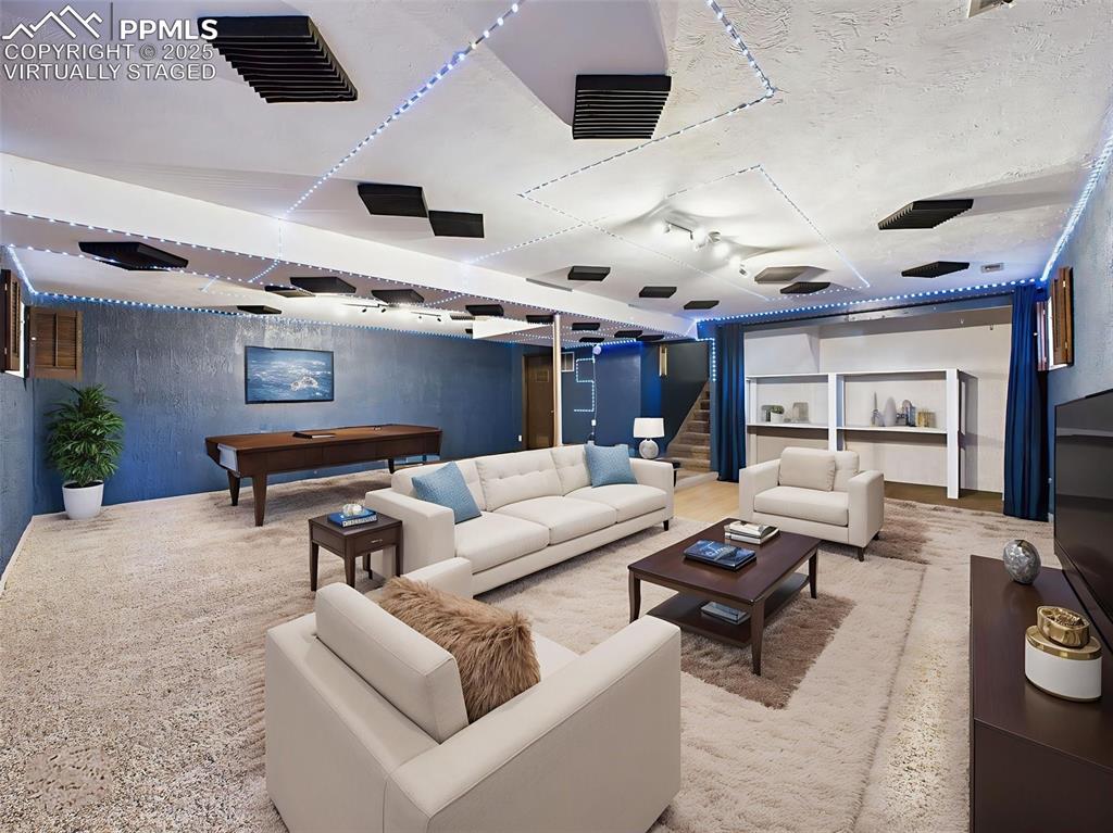 Virtually staged Basement rec room perfect for theater game room