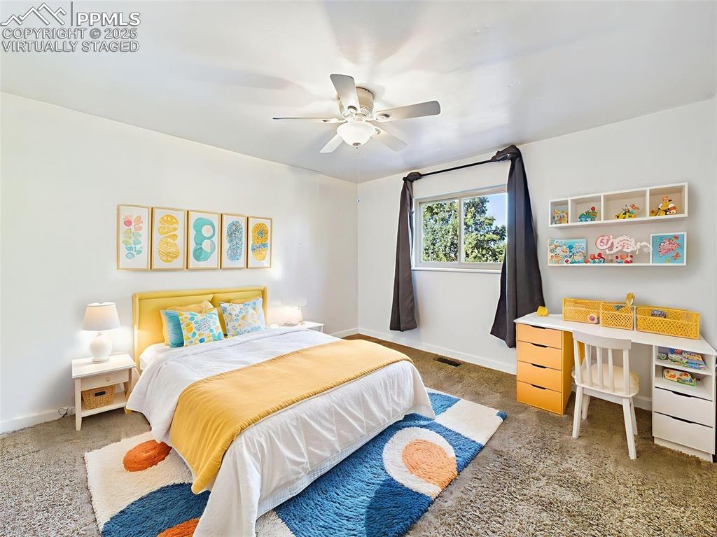 virtually staged Charming and colorful, this room is ideal for a child’s space or guest room, with generous closet storage and playful decor.