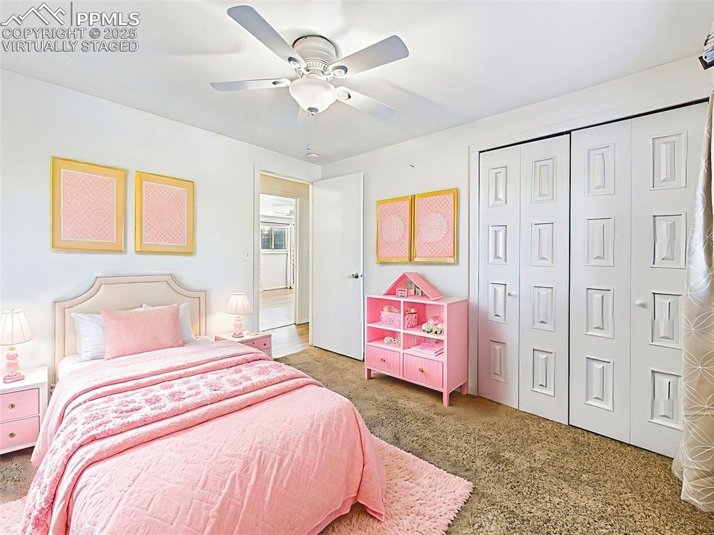 This third bedroom offers flexibility for guests, work, or relaxation—virtually staged with soft blue accents and a cozy layout.