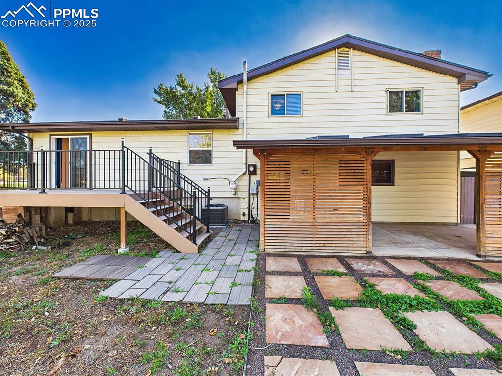 Low-maintenance backyard with a paver-style patio and privacy fencing, perfect for enjoying Colorado’s fresh air and sunshine.