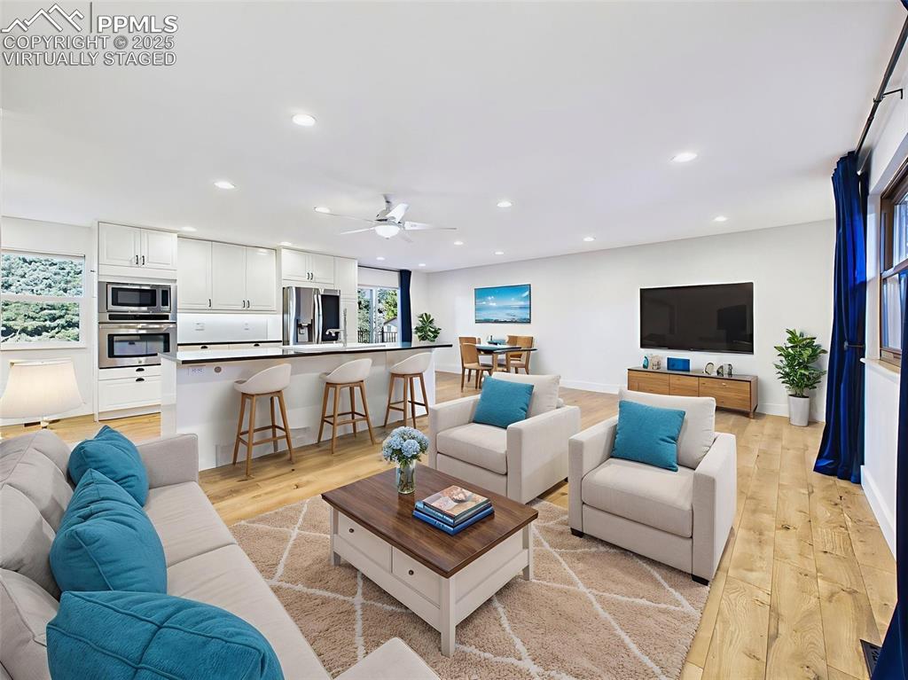 Virtually staged to show a comfortable layout, this open space accommodates both relaxing and dining with ease—perfect for everyday living.