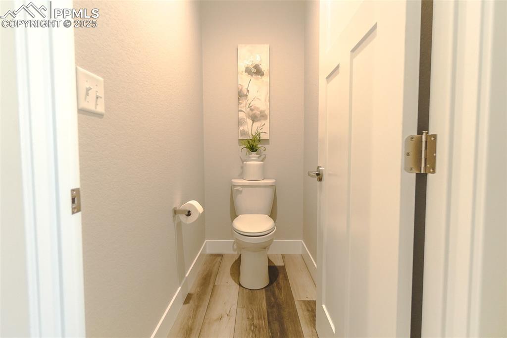 Bathroom with wood-type flooring and toilet