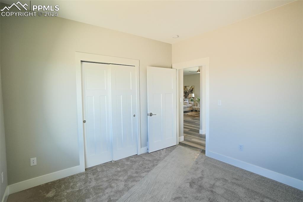 Unfurnished #3 bedroom featuring a closet and carpet