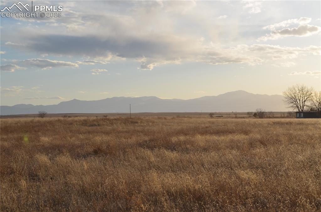 Property view of mountains featuring a rural view